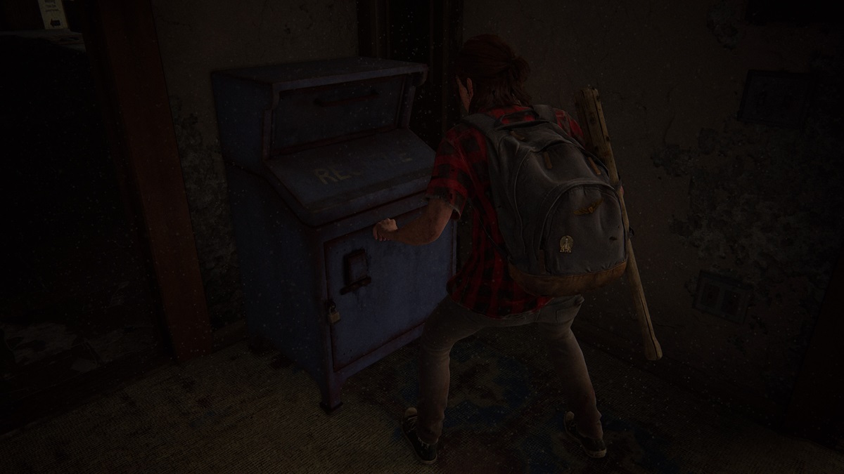 Ellie depositing items in a blue mailbox dead drop in TLoU2 No Return.