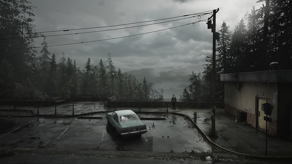 James in a parking lot looking over the lake in Silent Hill 2 Remake