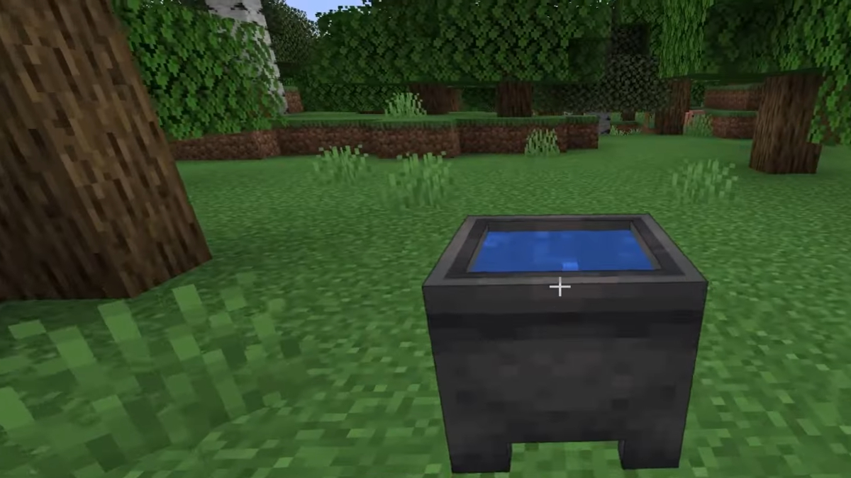 Removing dye from an armor using a cauldron with clear water in Minecraft.