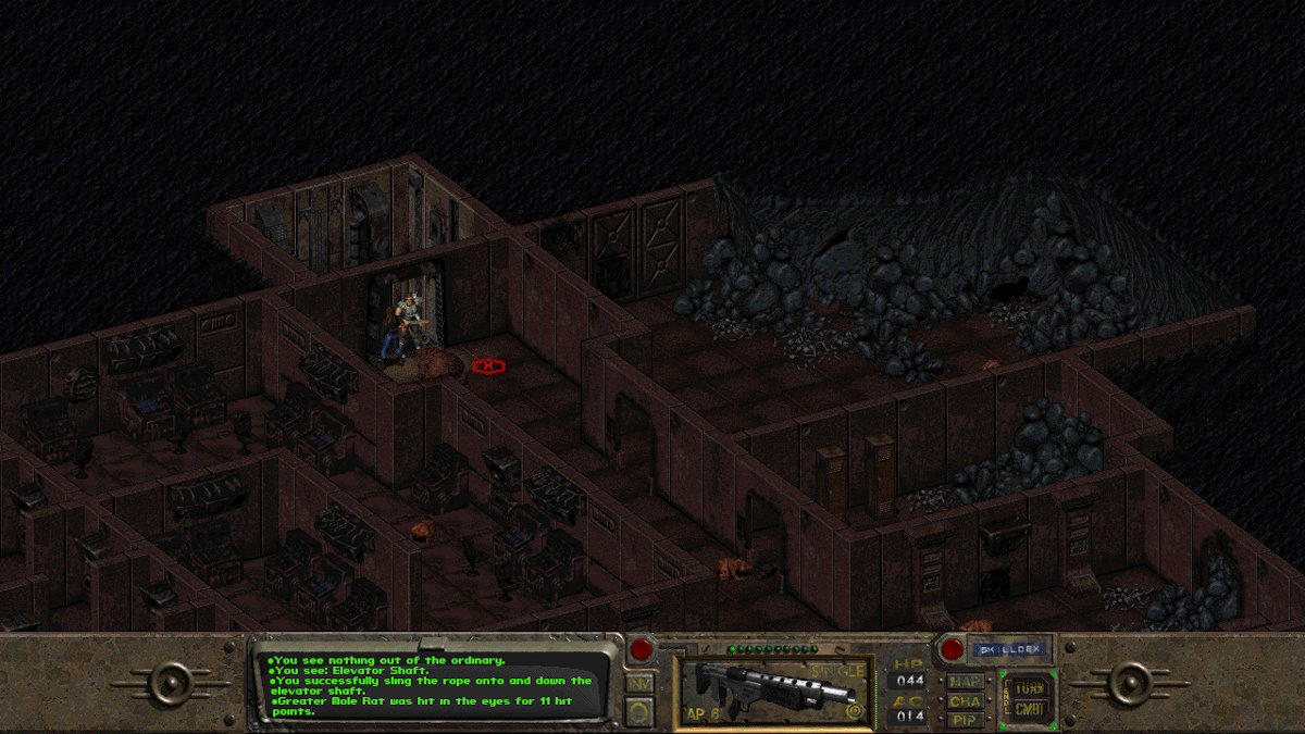 A dark scene cave seen from above in which the protagonist fights a giant gecko.