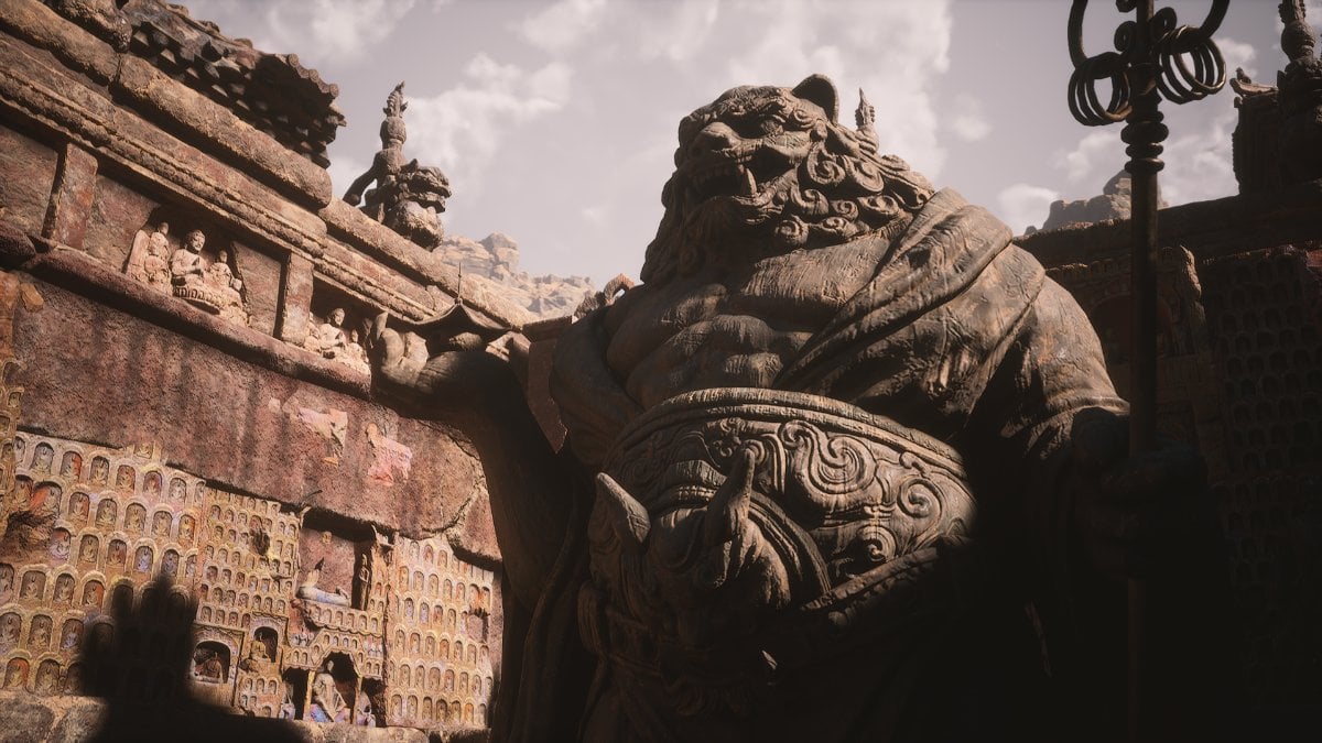 A giant statue in the desert in Black Myth: Wukong