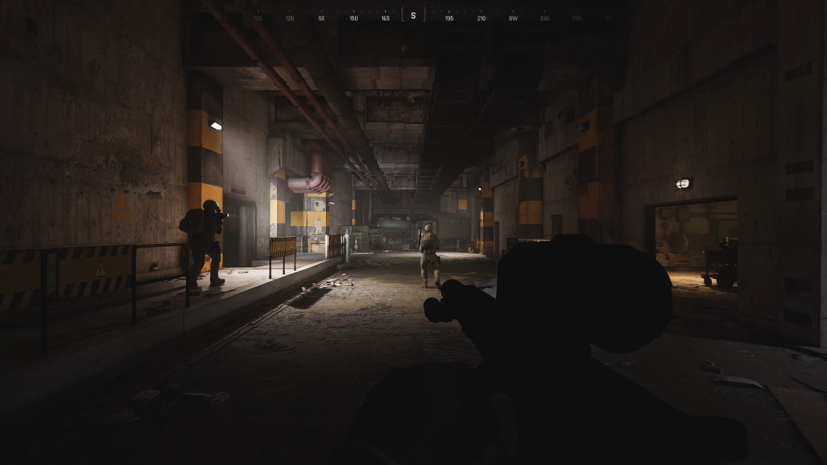 Three players go through the map with their guns.