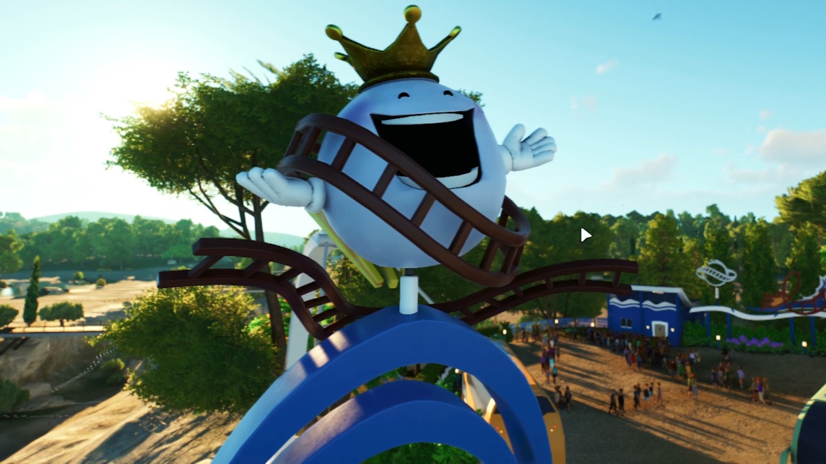 A mascot character from Planet Coaster 2 mounted on the entrance of a theme park