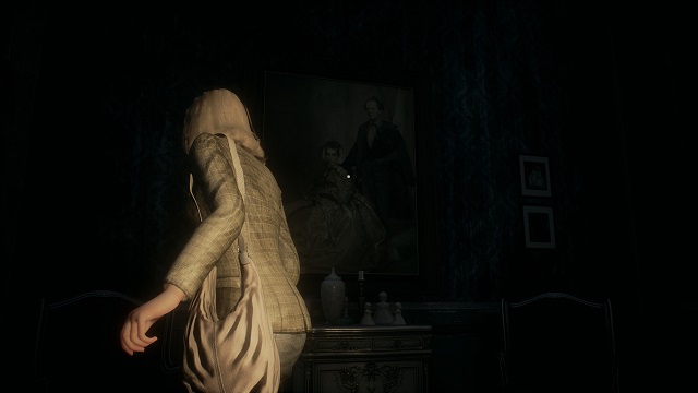 Remothered. Reed looks at a painting in a dark room.